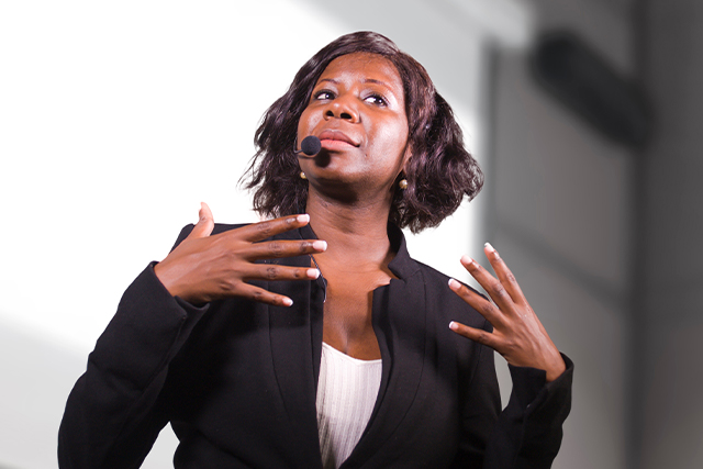 A confident female public speaker